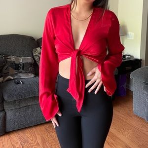 Red silky tie crop top with a few pulls on ties so not noticeable